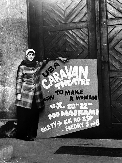 Winky Belz beside a Caravan Theater sign in Poland, 1971